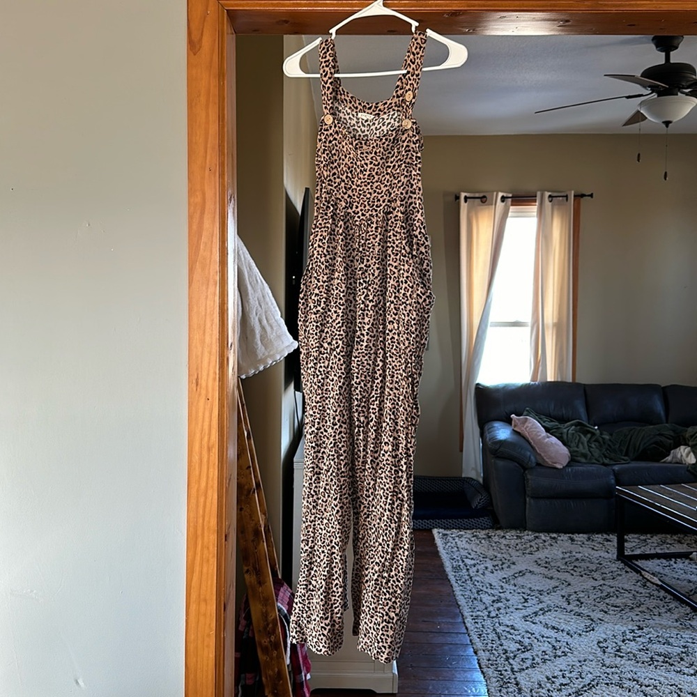 Cheetah print jumpsuit with pockets size L would fit a M